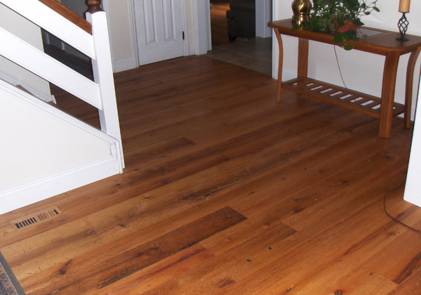 Red Oak flooring, remilled from log house and barn timbers.